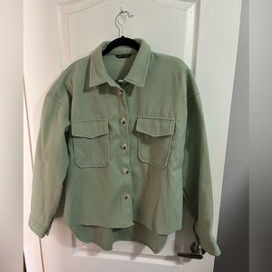Woman’s Shein green cropped jacket in size large.